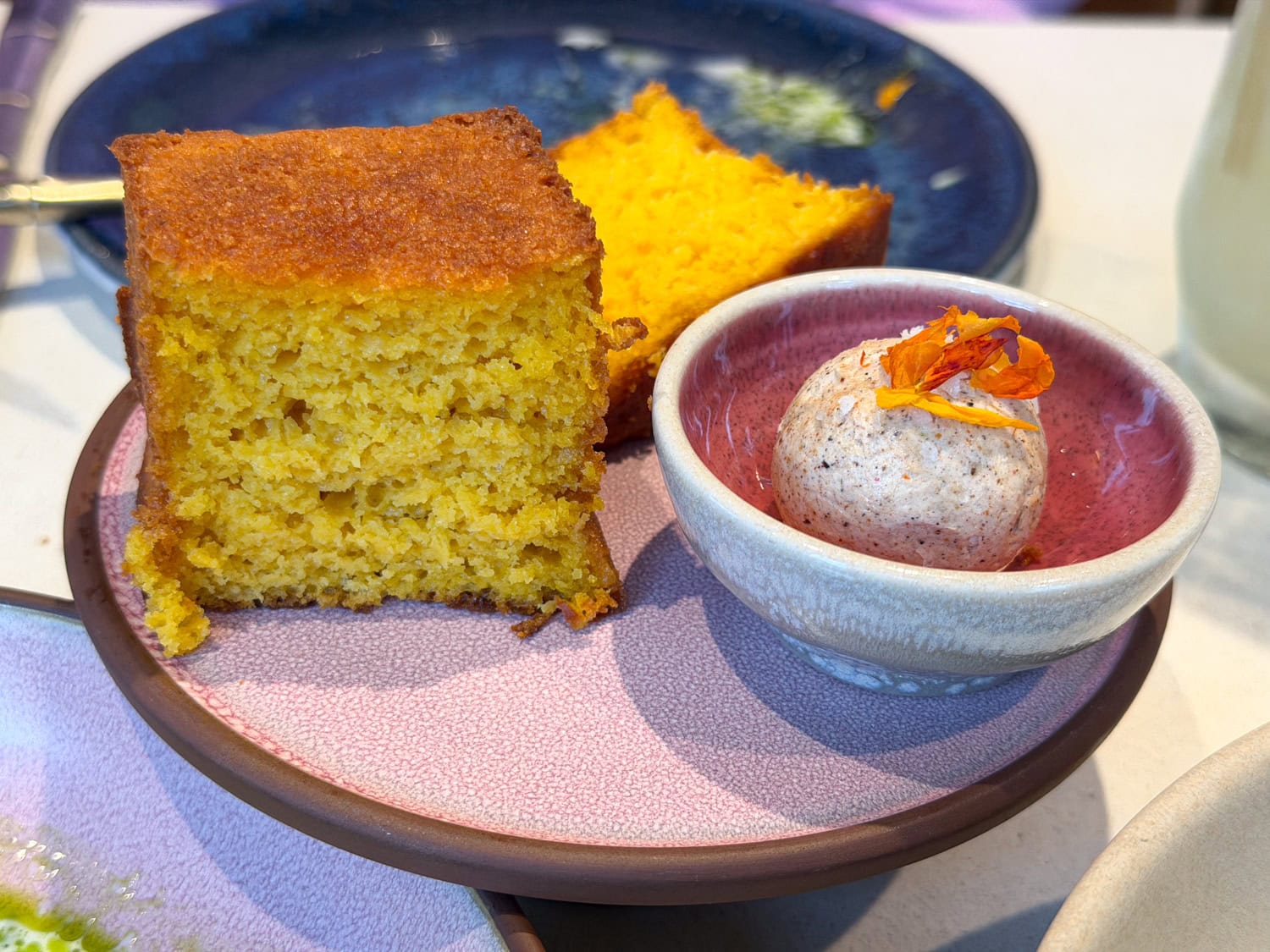 Slicing into sweet potato bread with berbere spiced butter.