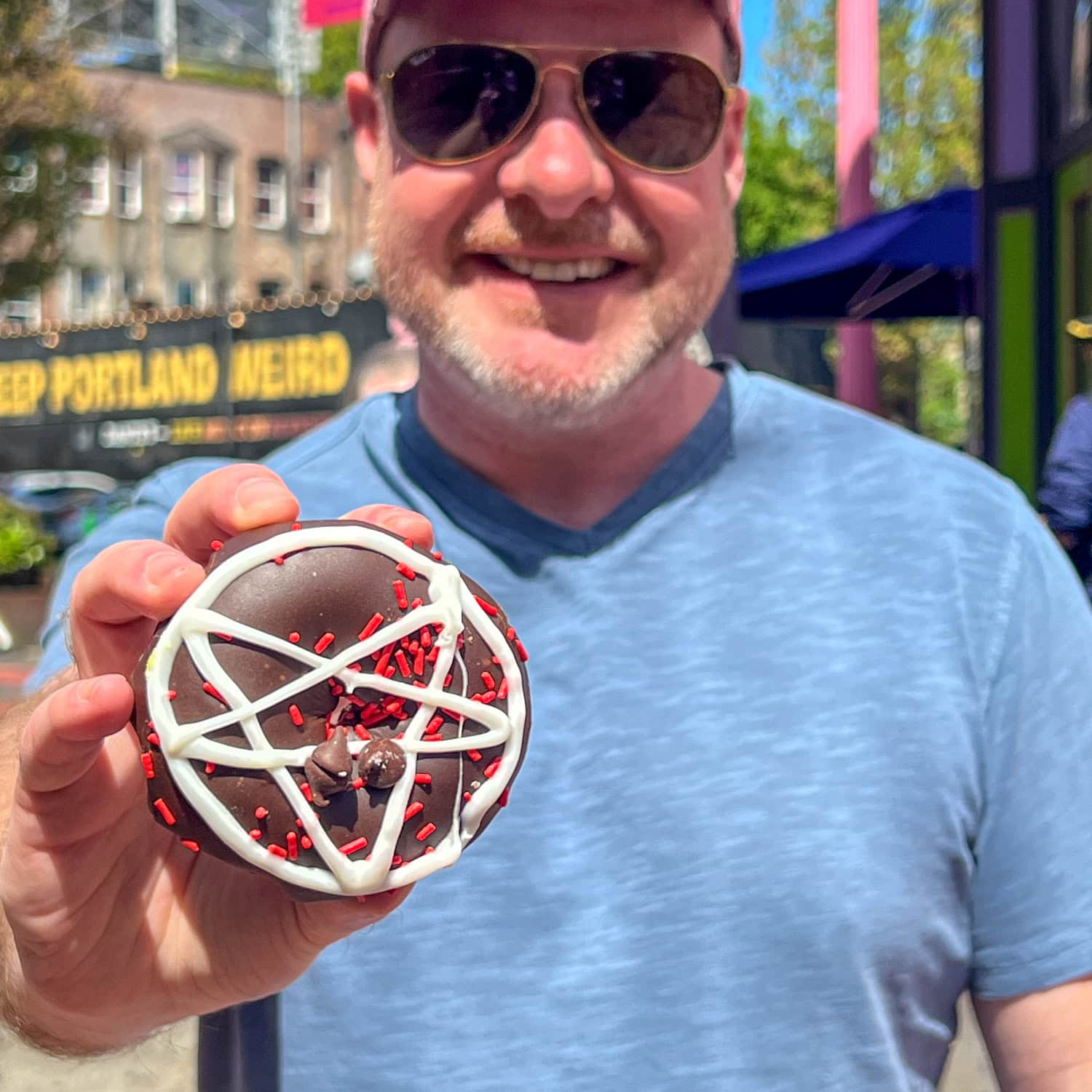 Dave with a chocolate Voodoo Doughnut (photo by Kelly Lemons).