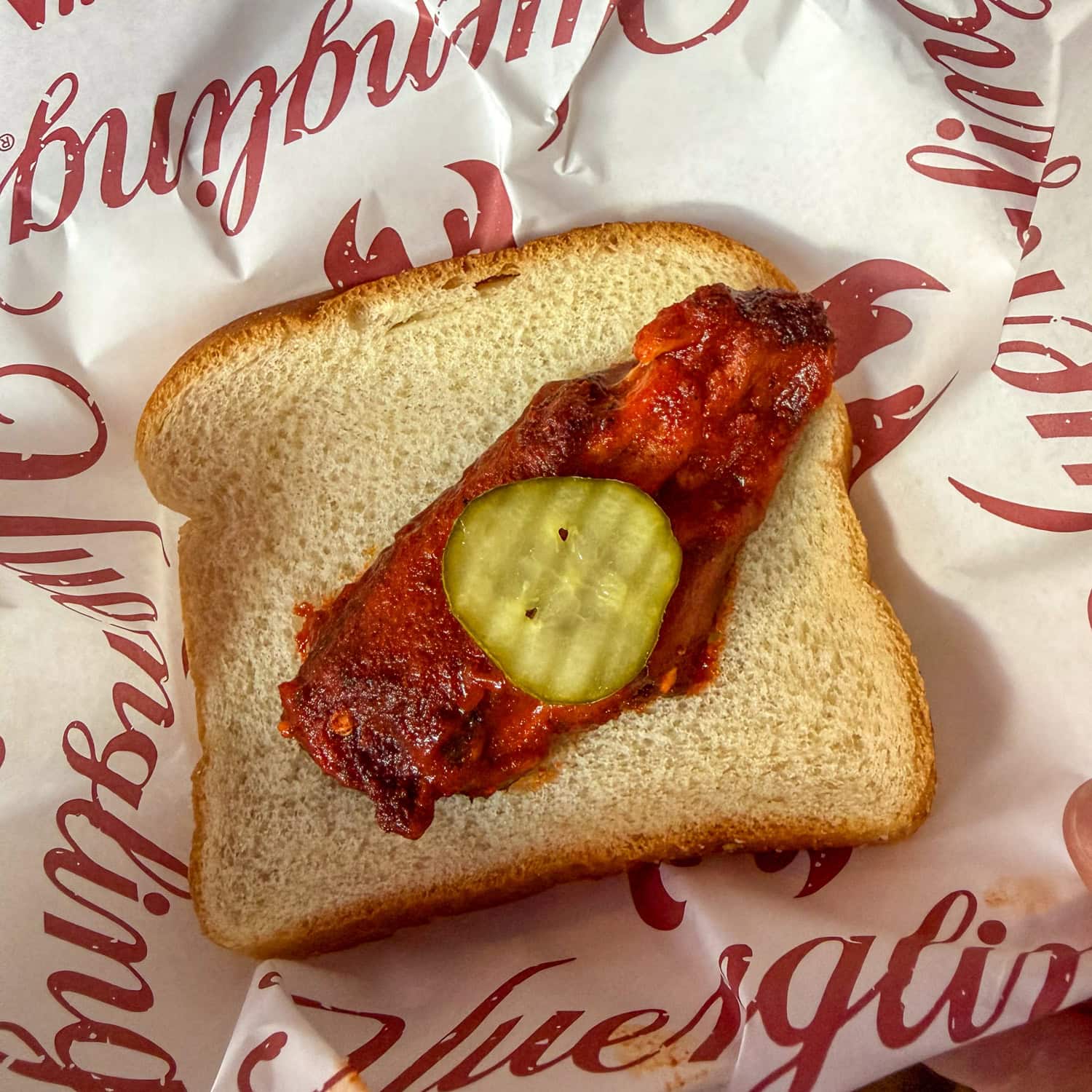 A Nashville hot chicken wing on white bread at Drifters BBQ.