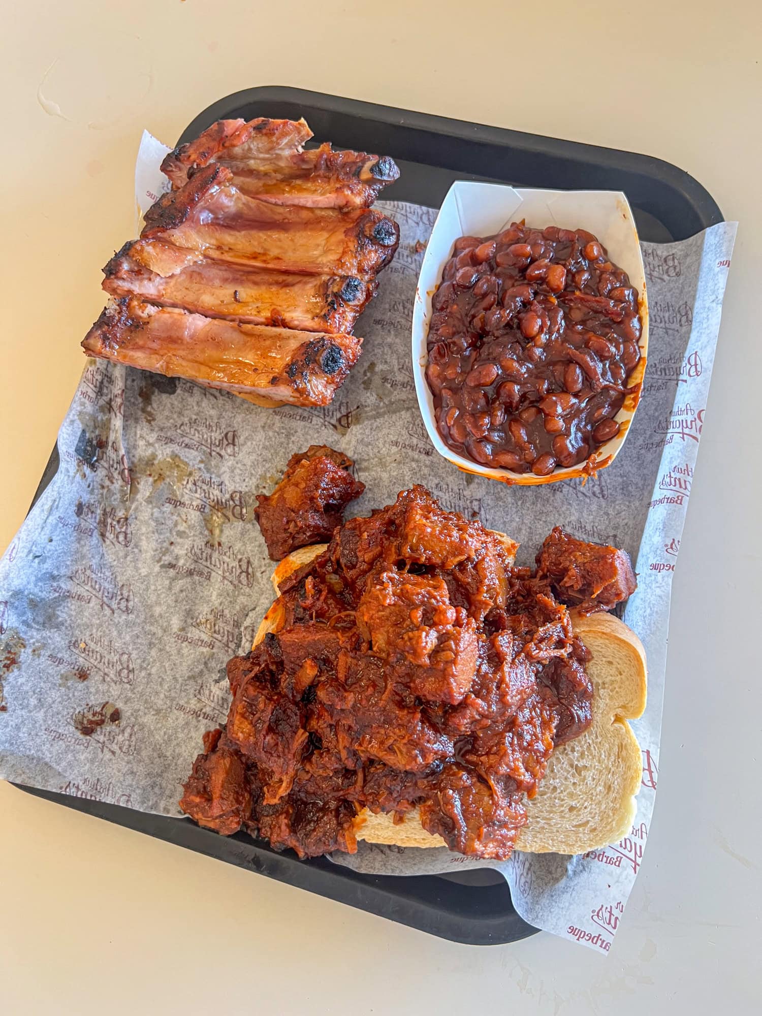 Burnt ends sandwich, ribs, and beans at Arthur Bryant's.