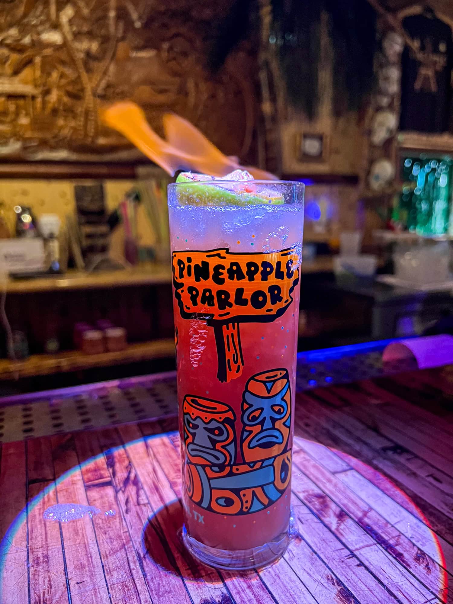 Zombie cocktail on fire at Pineapple Parlor tiki bar in Galveston, Texas.