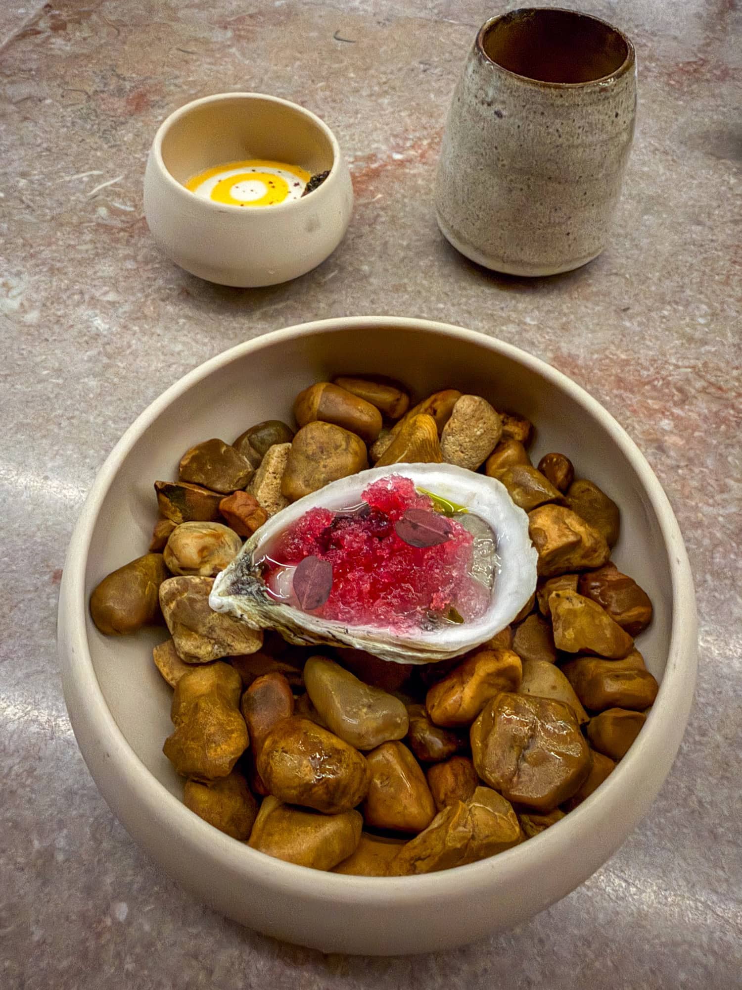 Hay-smoked oyster and sweet tea at Catbird Seat in Nashville.