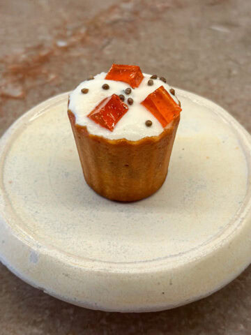 Foie gras pie with seeds, citrus, and candied seaweed cream in a potato croustade.