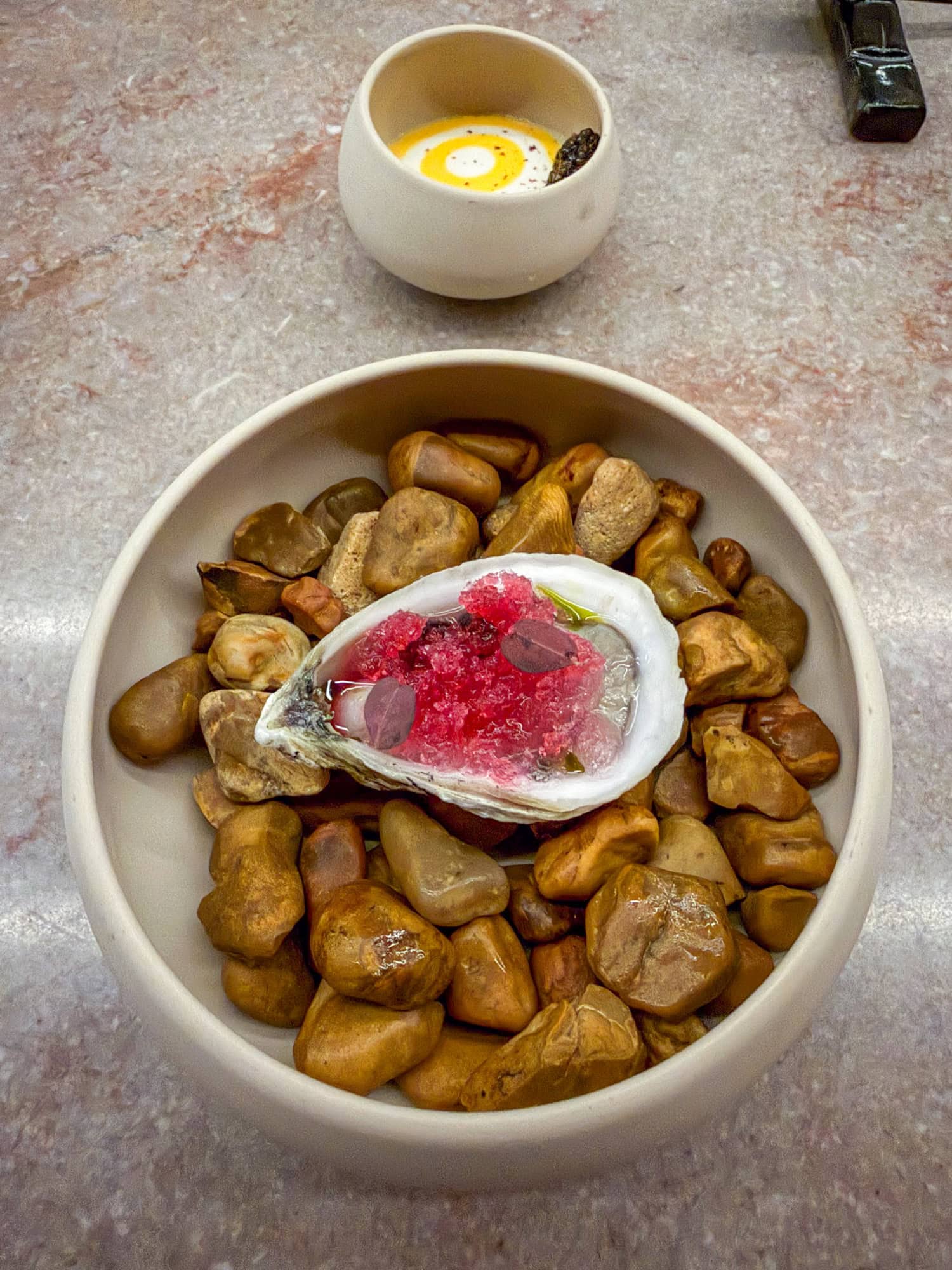 Hay-smoked oyster served with caviar custard at The Catbird Seat in Nashville.
