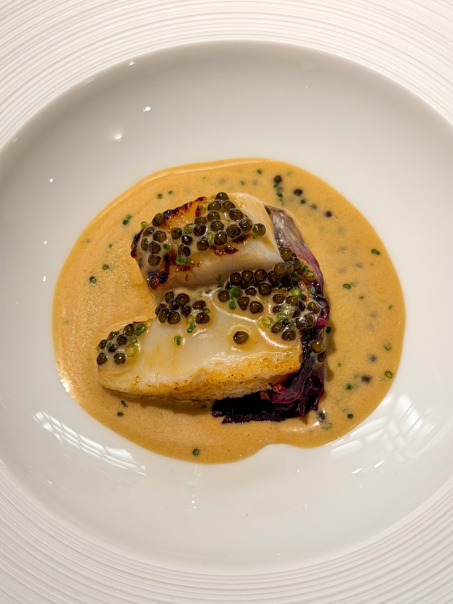 Cobia and scallop with Kaluga caviar at Emeril's in New Orleans.
