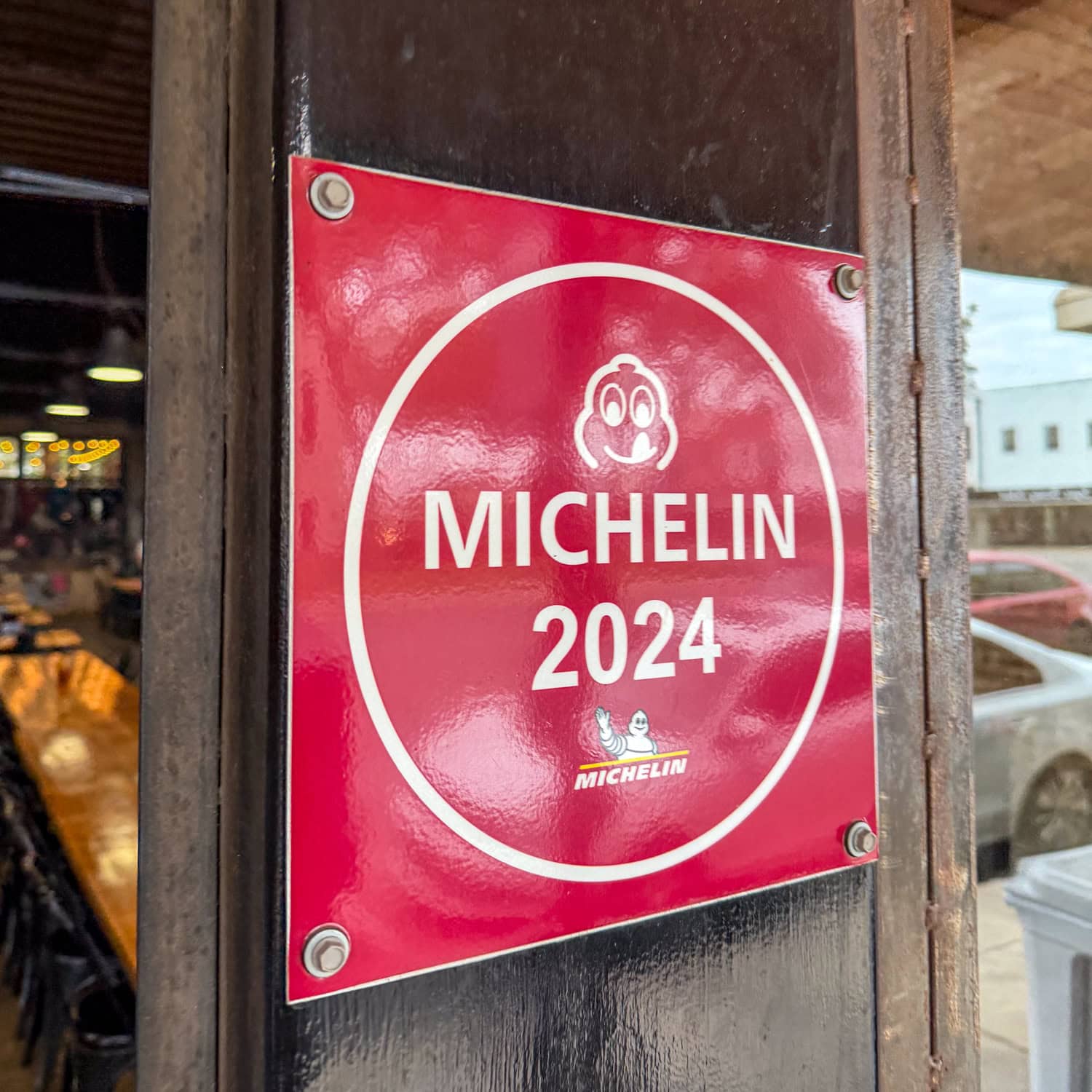 2024 Michelin Bib Gourmand sign at Burnt Bean Co. in Seguin, TX.