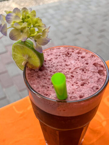 A glass of chicha morada, a purple corn drink in Peru.