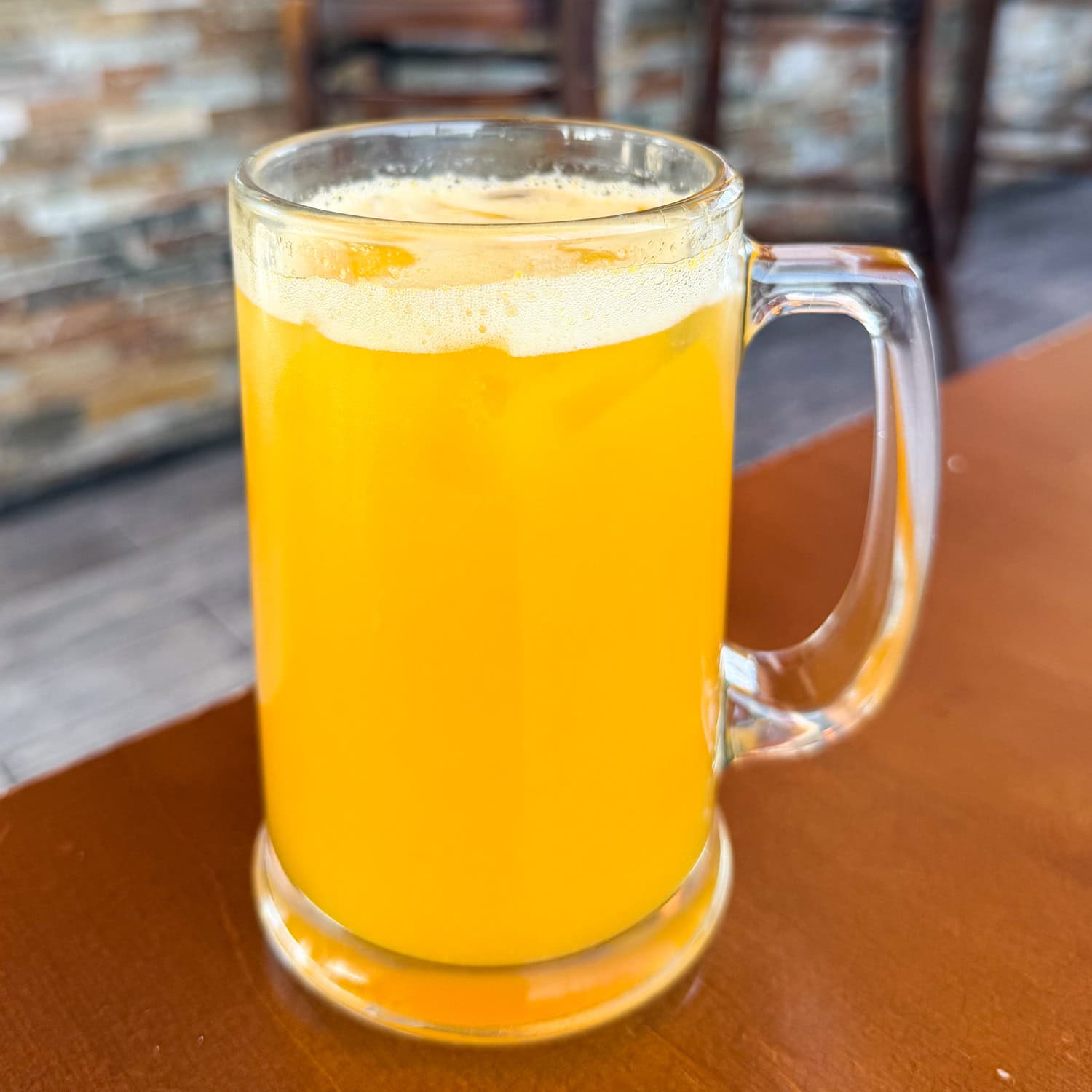 A glass of fresh maracuyá juice made with passion fruit.