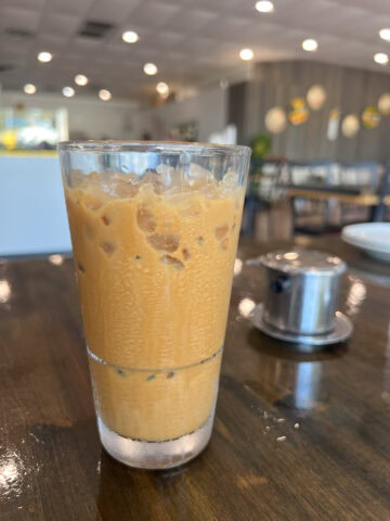 Vietnamese iced coffee (ca phe sua da) made with condensed milk and brewed with a phin filter.