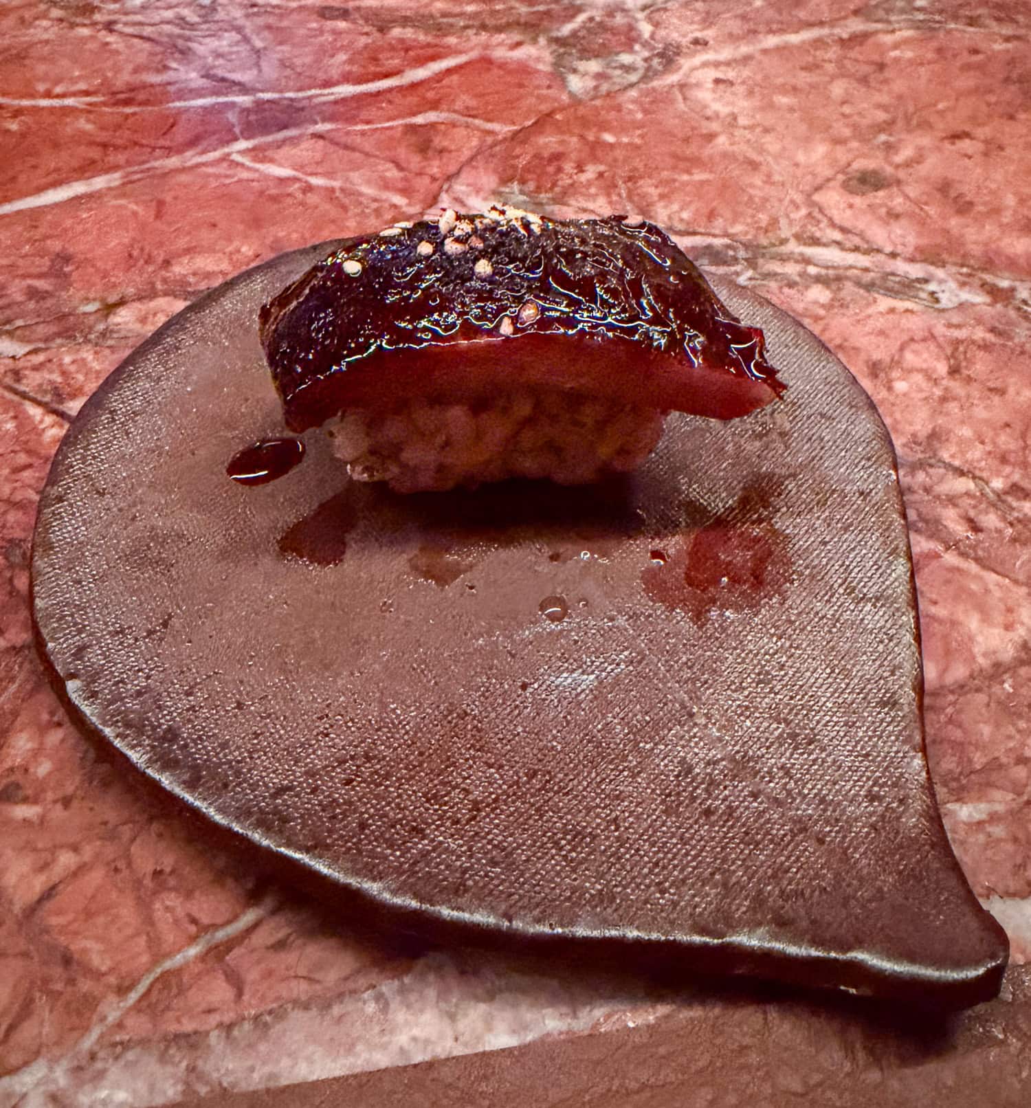 American unagi nigiri topped with Oaxacan mole at Anbā in New York City.