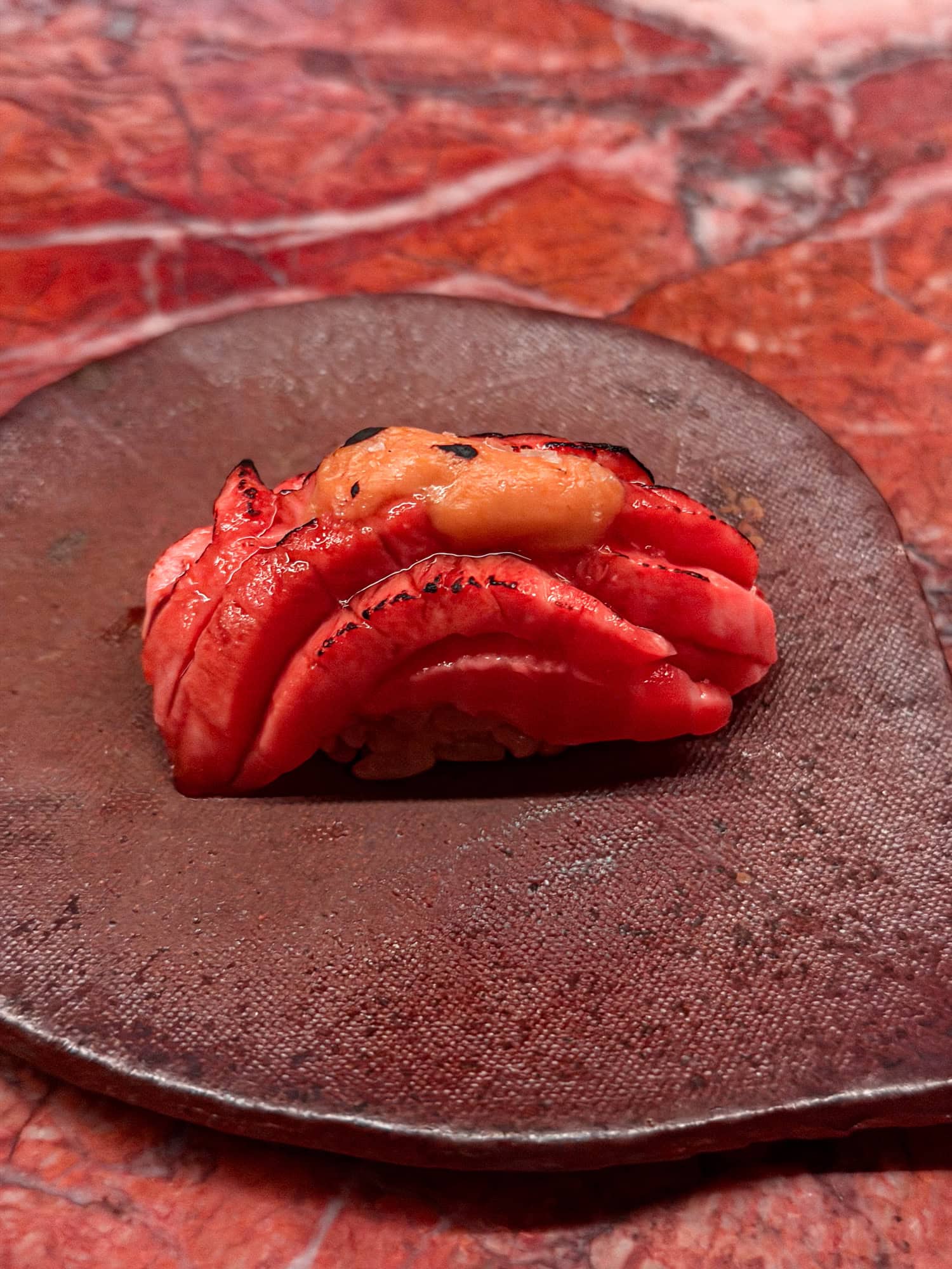 Ora King salmon nigiri at Anbā in New York City.