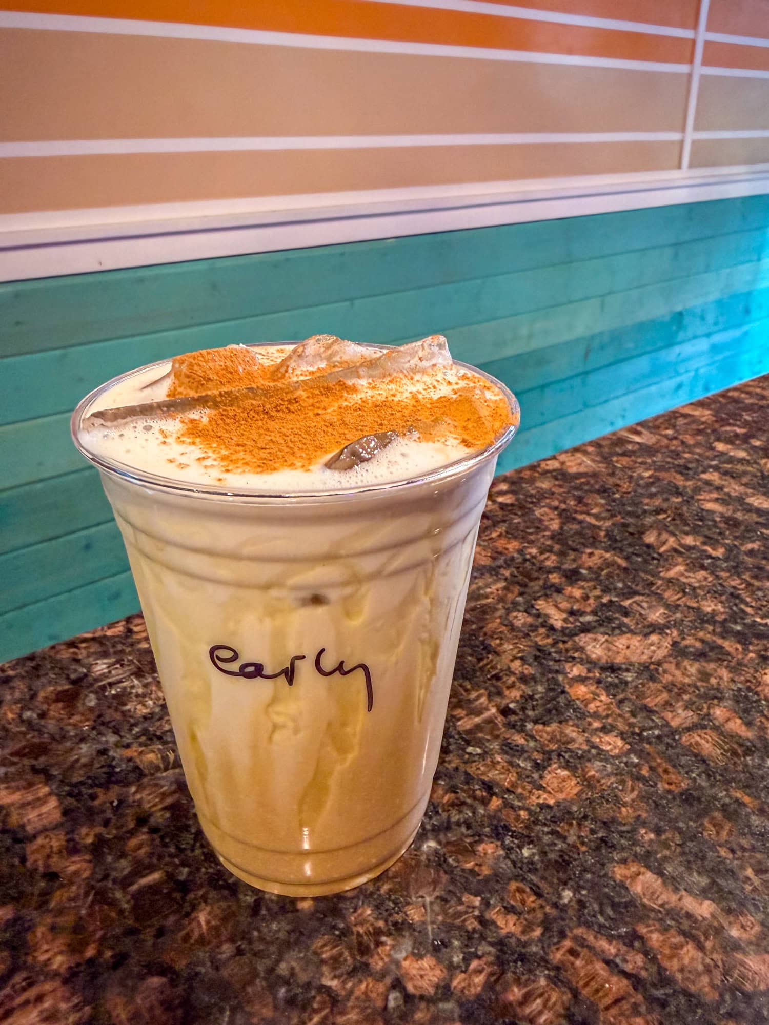 Iced Early Riser coffee with espresso, oat milk, Kauai honey, and cinnamon at Imua Coffee Roasters.