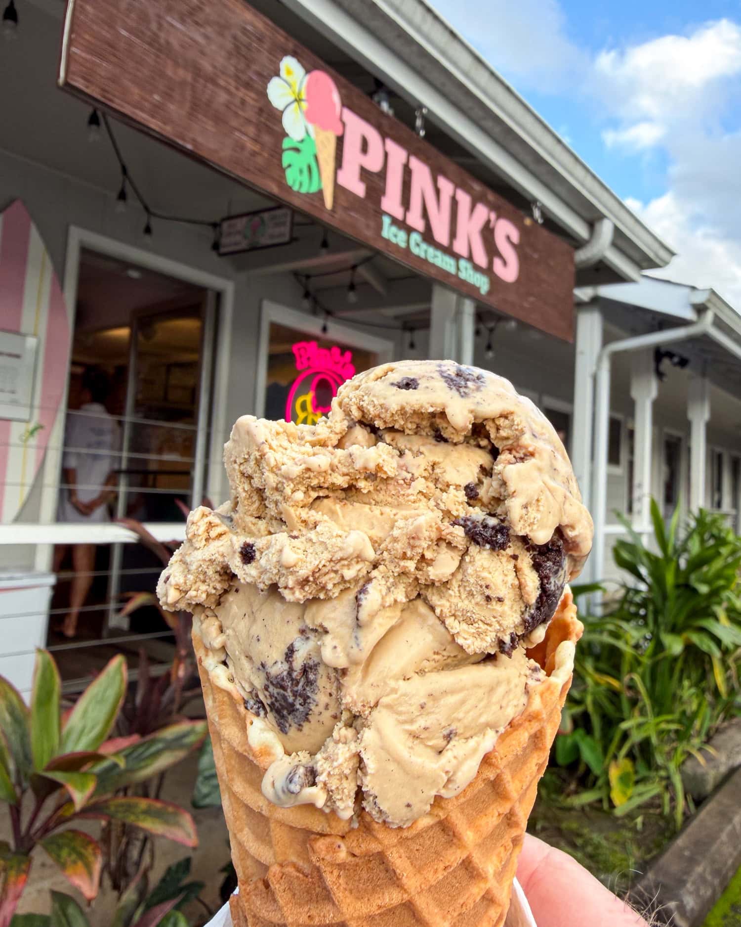 Kona mudslide ice cream cone in front of Pink's Ice Cream Shop in Hanalei
