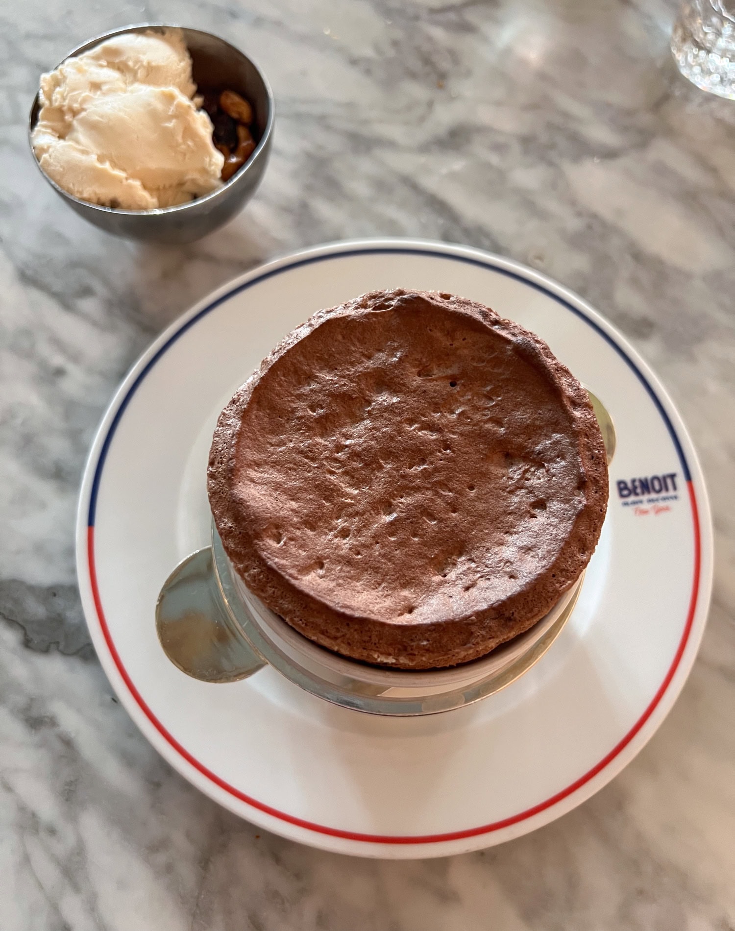 Chocolate soufflé with peanut ice cream served at Benoit, one of many stellar French NYC restaurants.