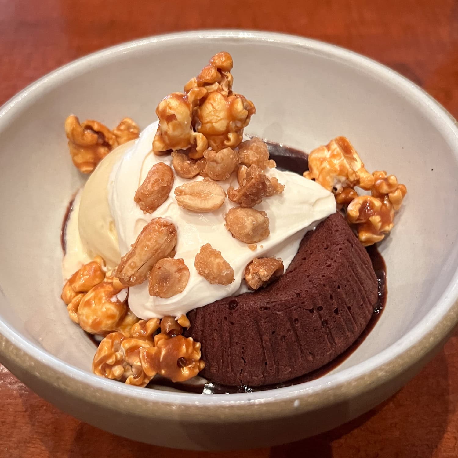 Chocolate dessert with whipped cream, caramel popcorn, and candied peanuts at Gramercy Tavern in Manhattan.