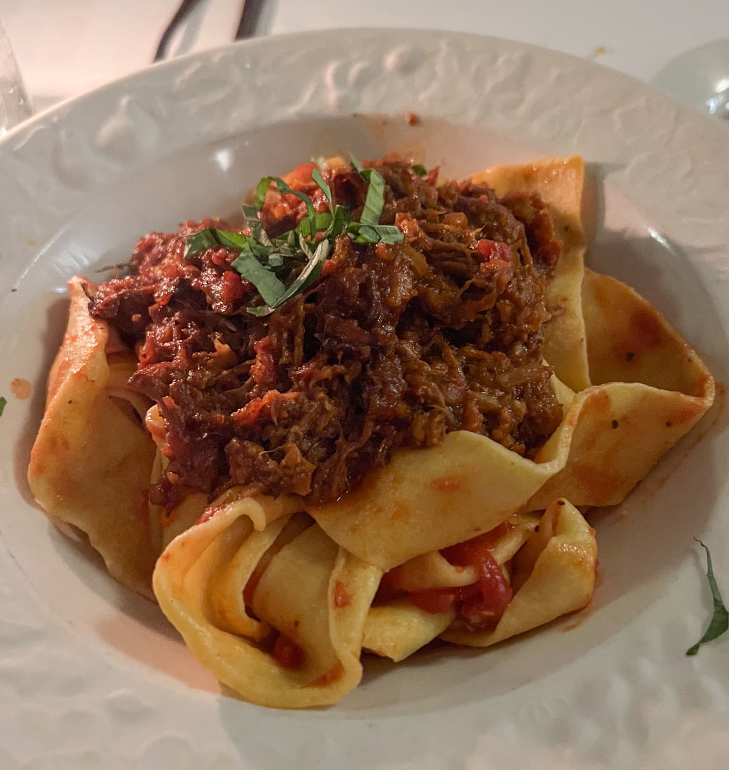Pappardelle pasta topped with a rich meat ragu at John's of 12th Street.