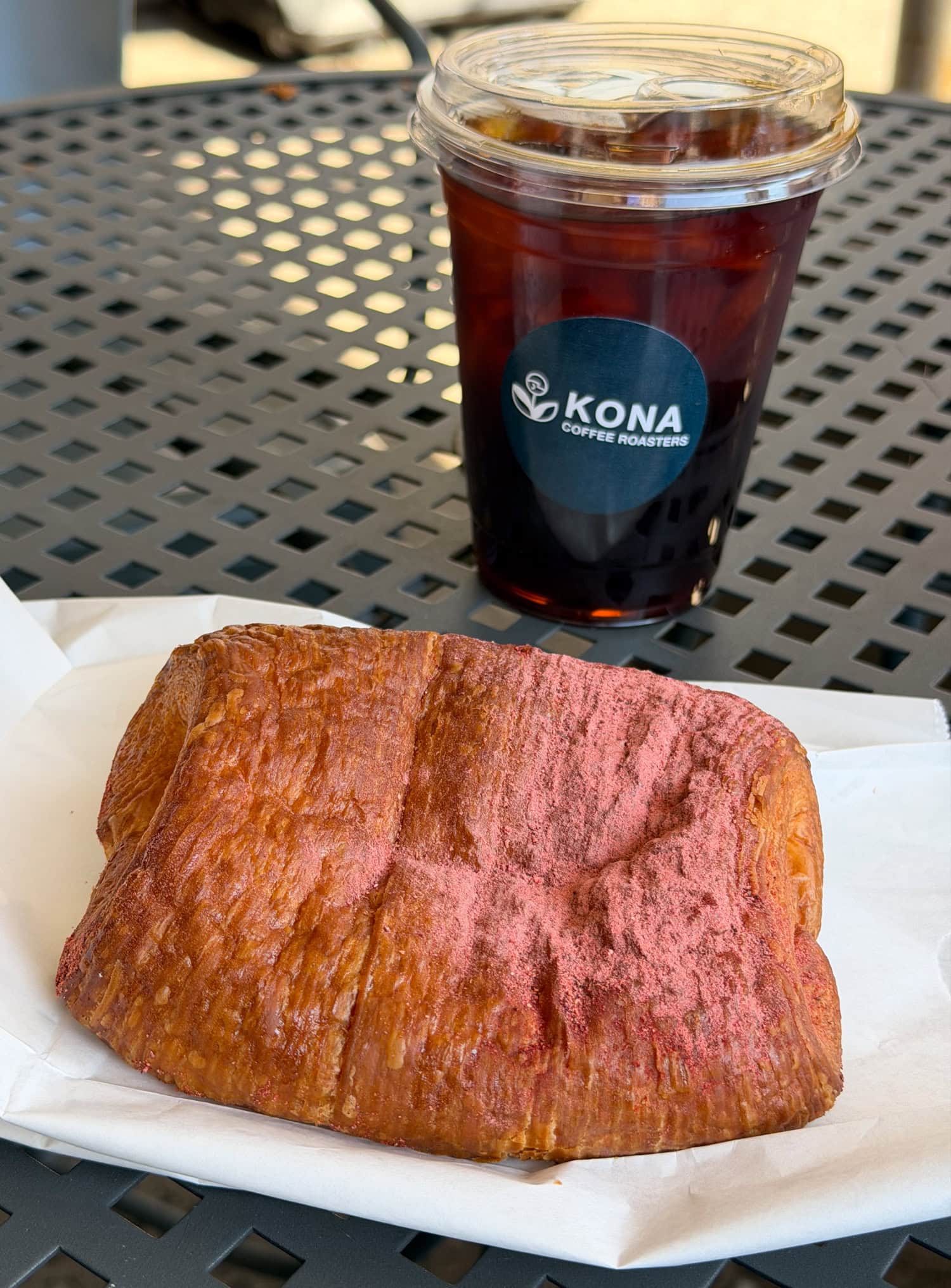 Cold brew coffee and pastry at Kona Coffee Roasters