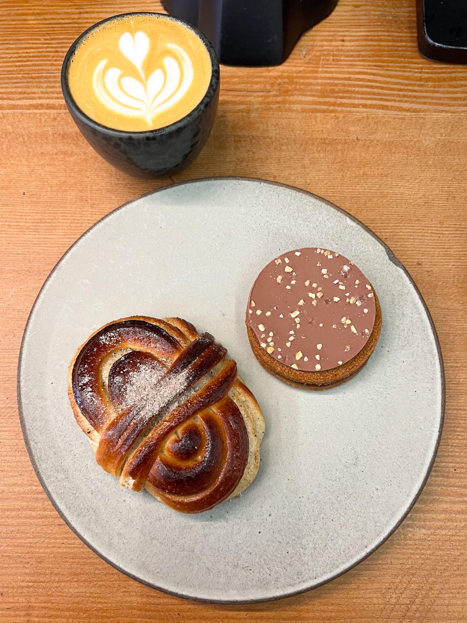 Cardamom latte and cardamom bun at La Cabra coffee shop in the East Village of NYC