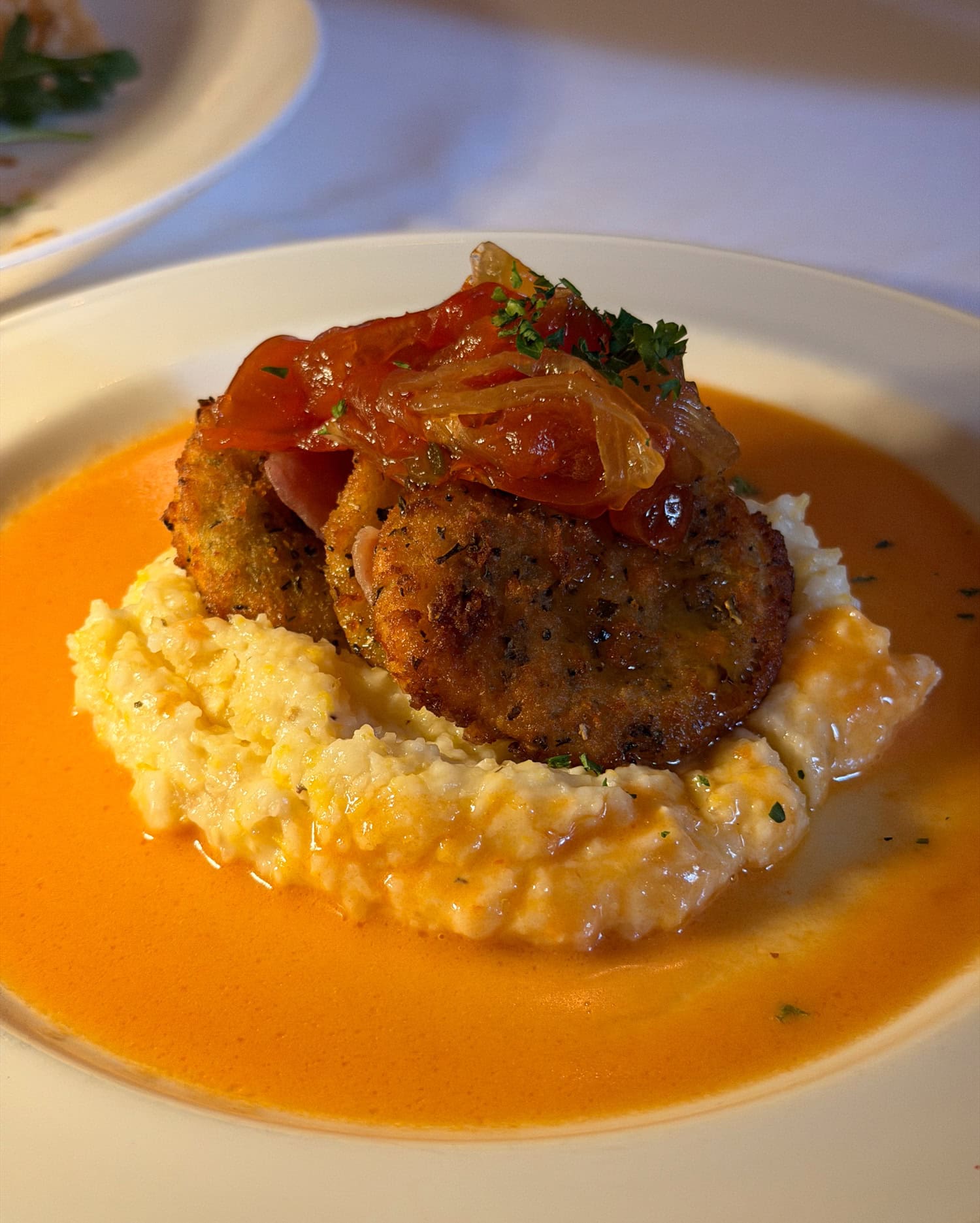 Fried green tomatoes with grits, country ham, and tomato chutney at Magnolias