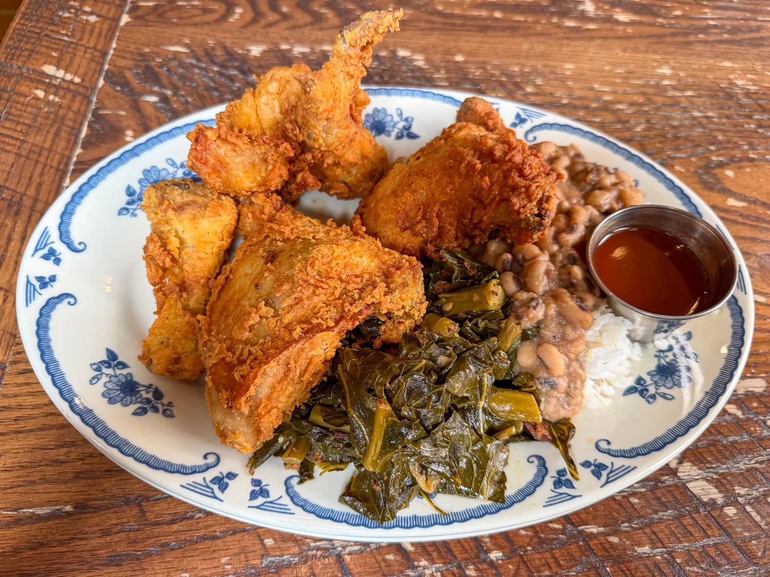 Fried chicken with collard greens and Hoppin' John at Poogan's Porch