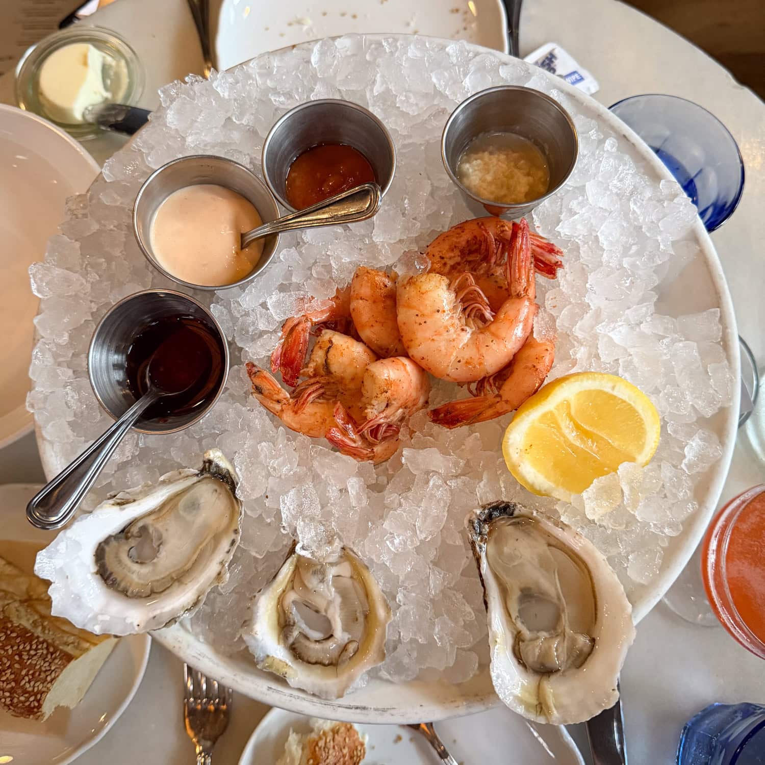 Raw oysters and peel-and-eat shrimp served on ice at The Ordinary