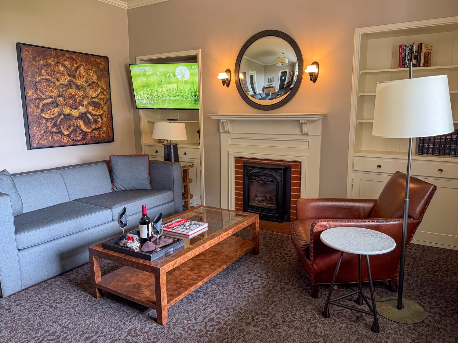 Living room in a Classic King Suite at the Inn at the Presidio with a sofa and fireplace