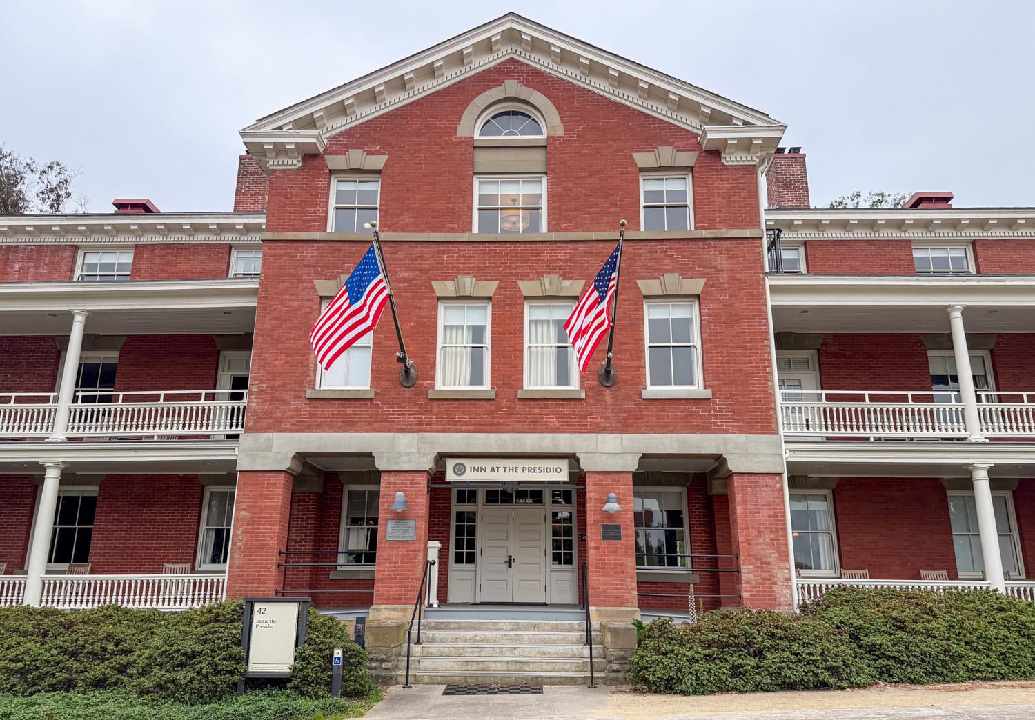 Front exterior of red-brick Pershing Hall, home of the Inn at the Presidio in San Francisco