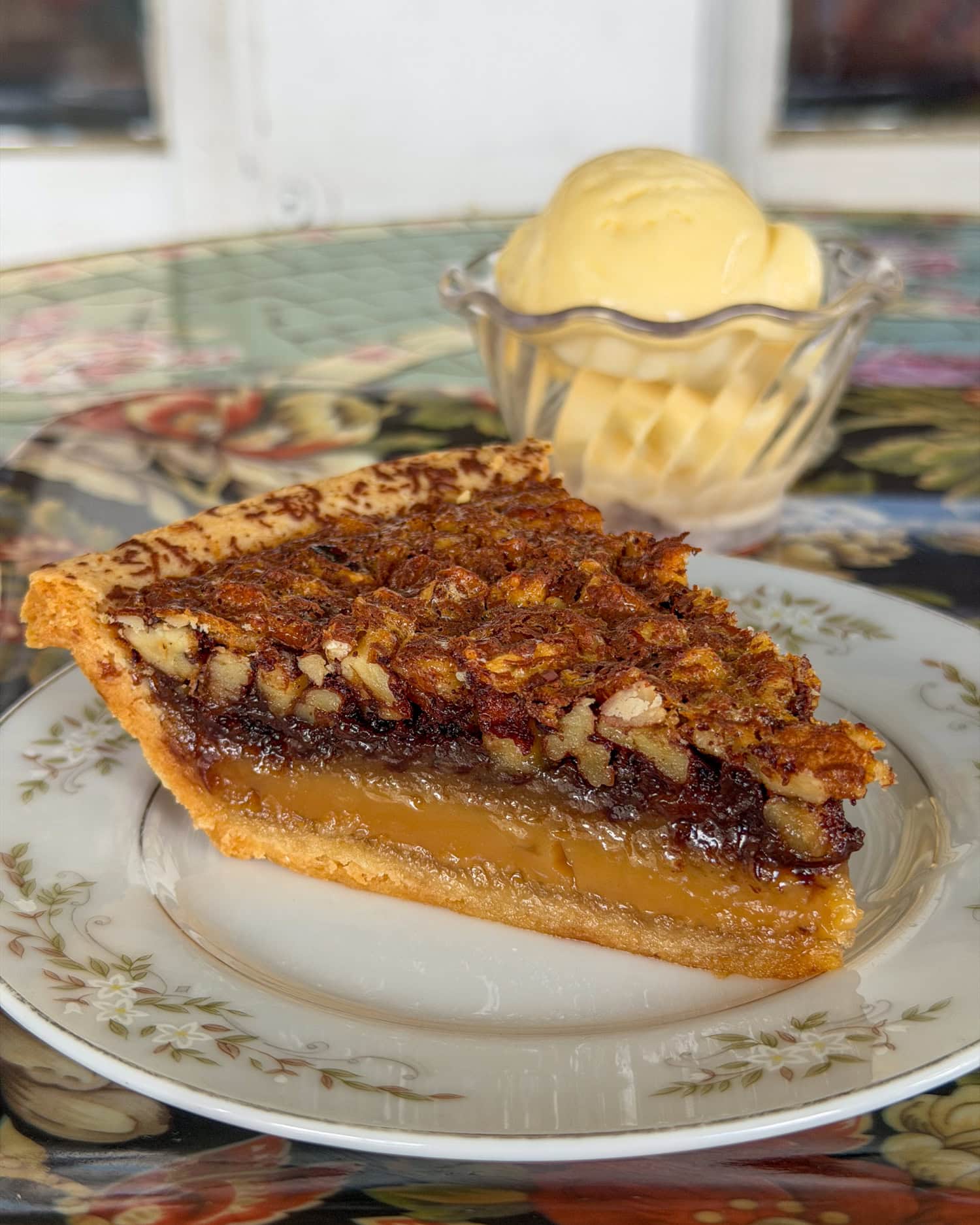 Slice of chocolate-pecan pie with vanilla ice cream at Fredericksburg Pie Company