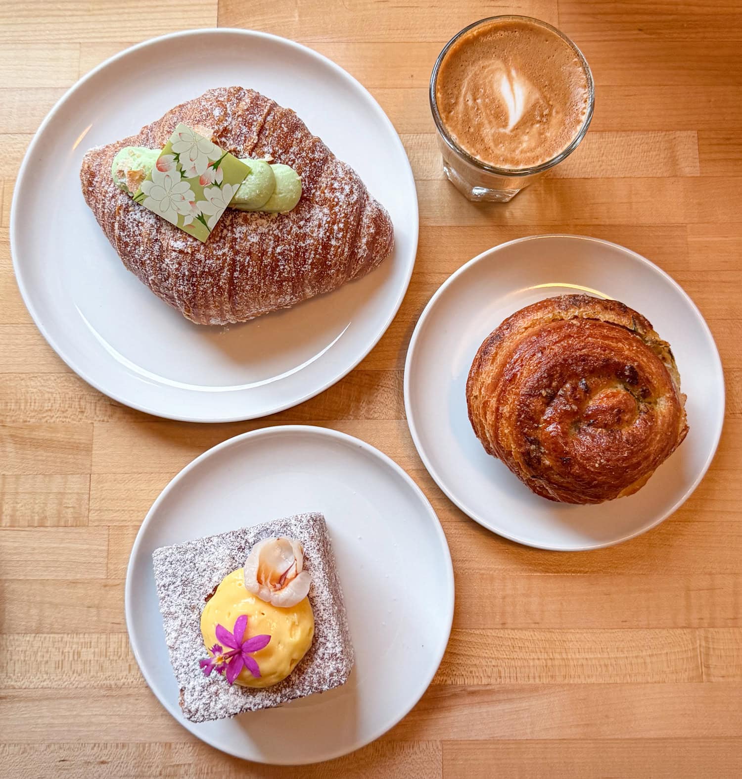 Overhead view of three pastries and a cortado at Diane's Place in Minneapolis.
