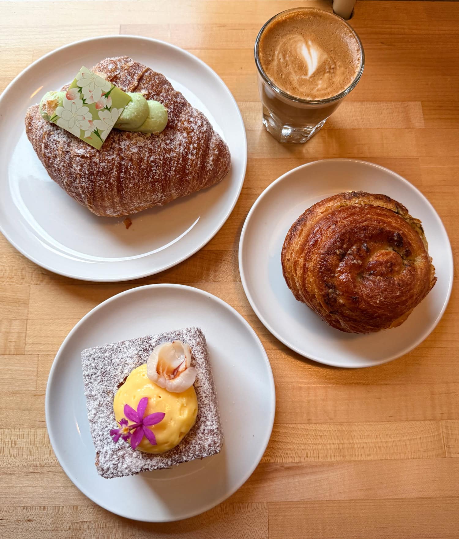 Coconut pandan croissant, mango passion fruit lychee croissant and green scallion Danish at Diane's Place