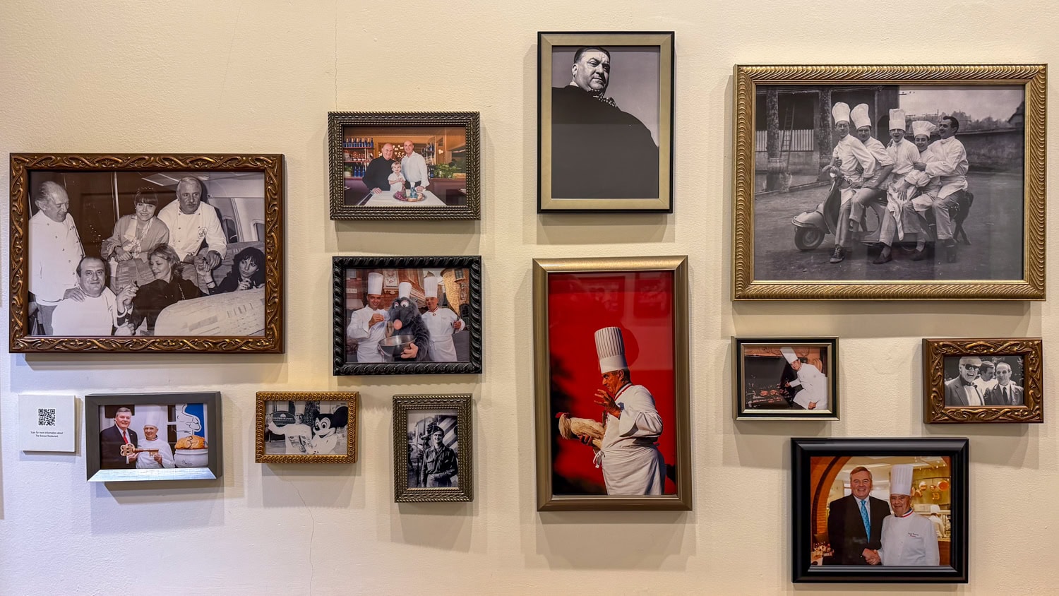 Gallery wall displaying framed photographs of French chef Paul Bocuse at the Culinary Institute of America.