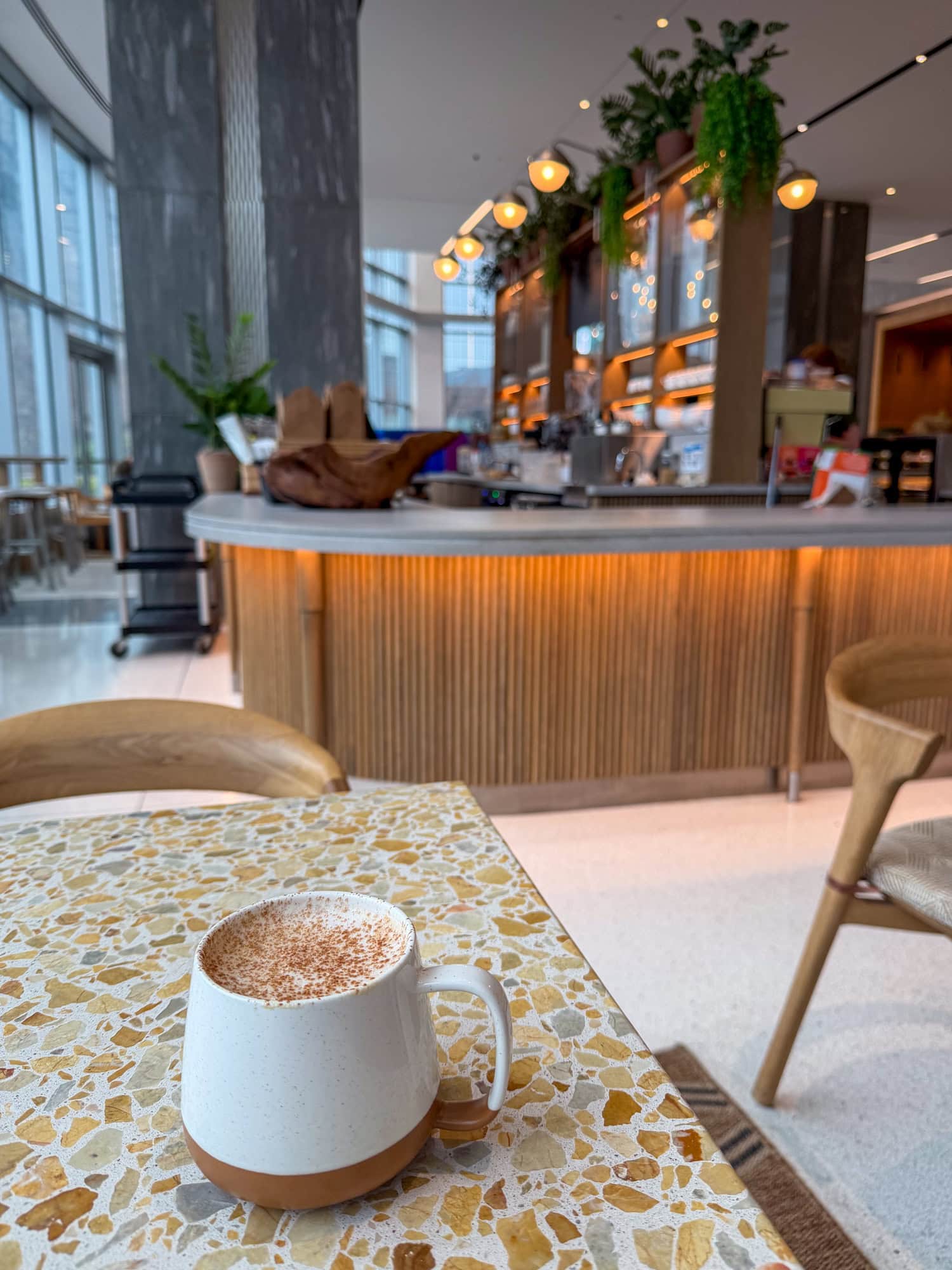 Socca Café Miel on a terrazzo table inside the Four Seasons Hotel Minneapolis