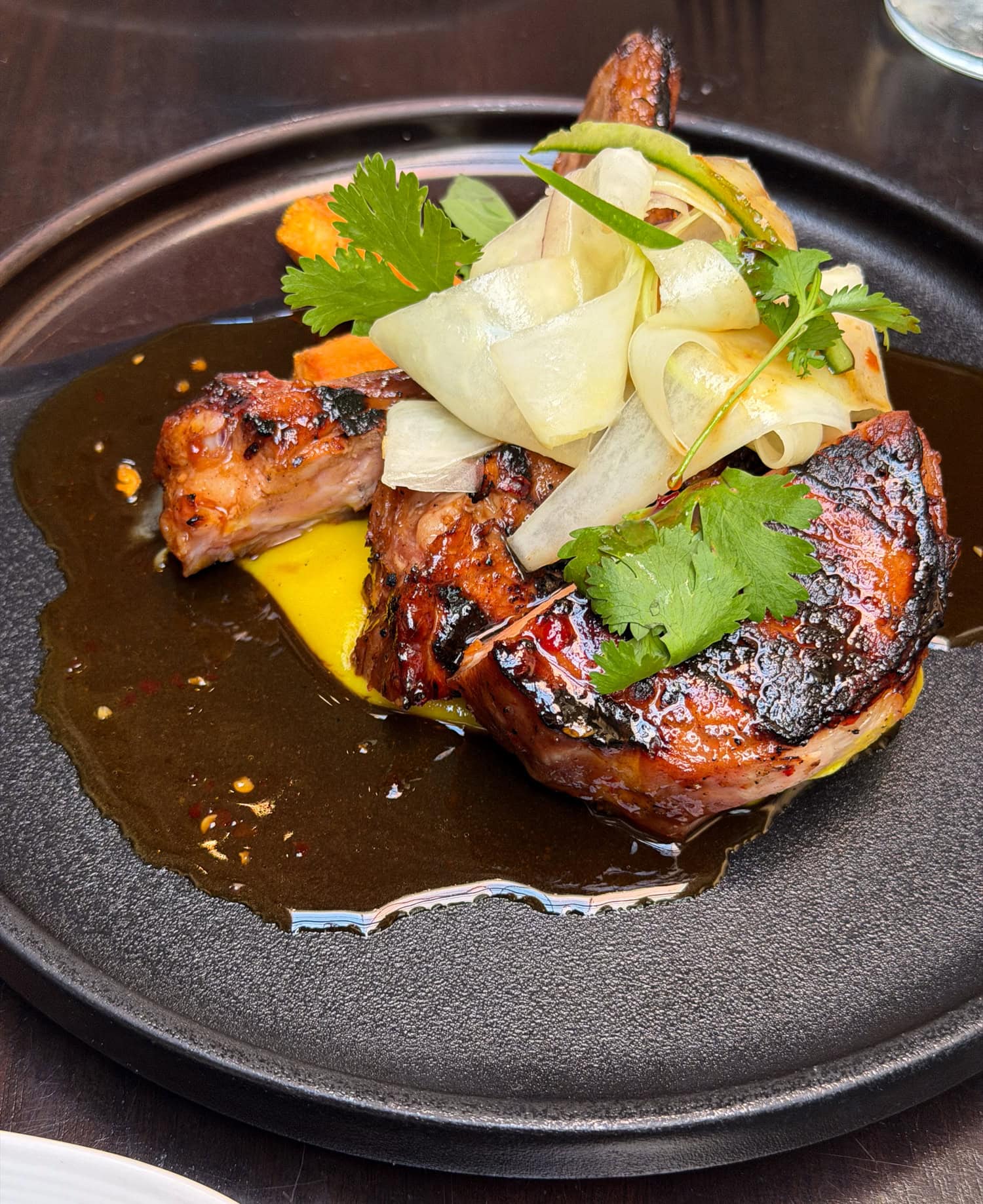 Glazed pork chop with green papaya slaw at Spoon and Stable in Minneapolis