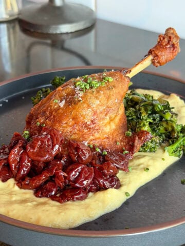 Duck leg with greens and purée at Bar Purlieu in Eugene, Oregon.