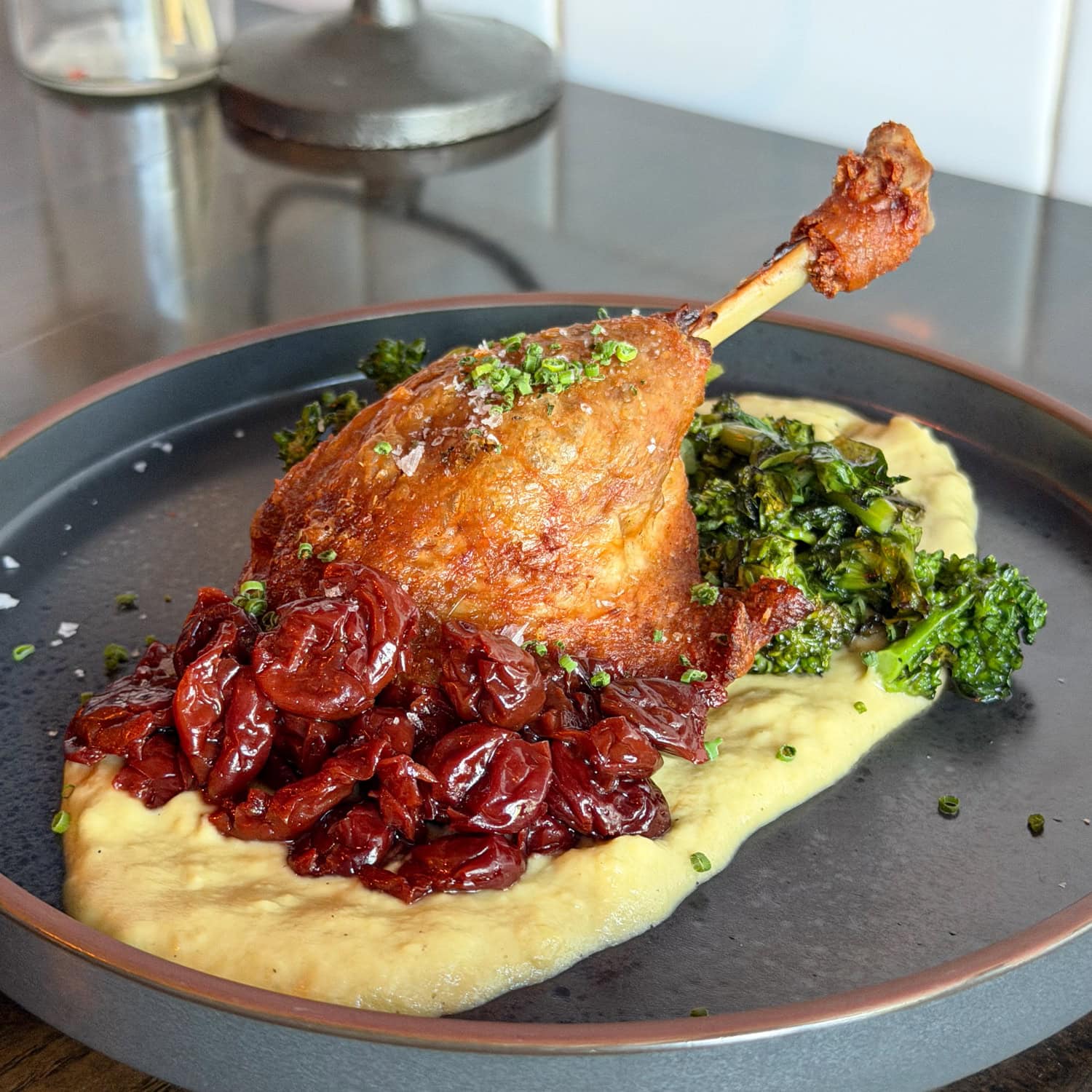 Duck leg with greens and purée at Bar Purlieu in Eugene, Oregon.