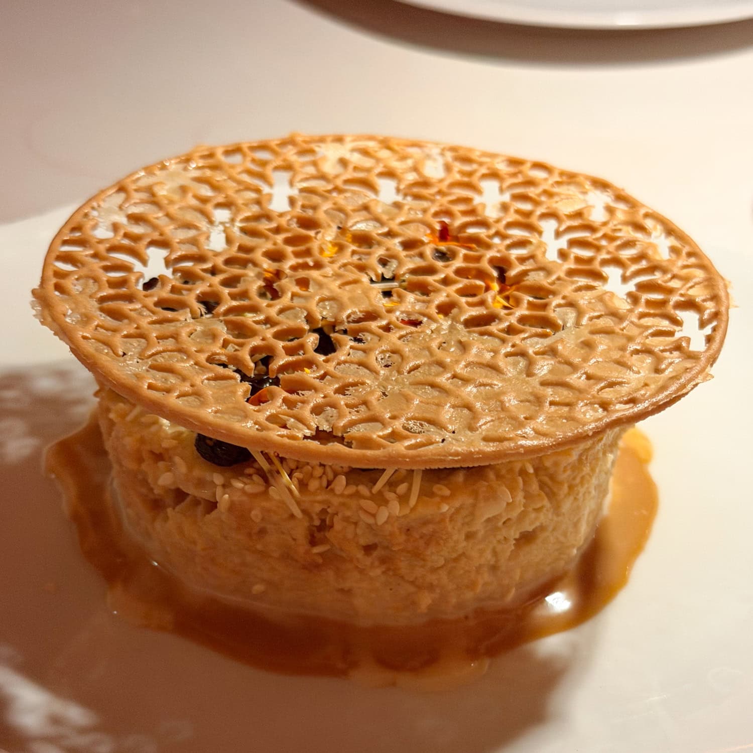 Pan de elote tres leches topped with a golden lattice at Mexta in downtown Austin.