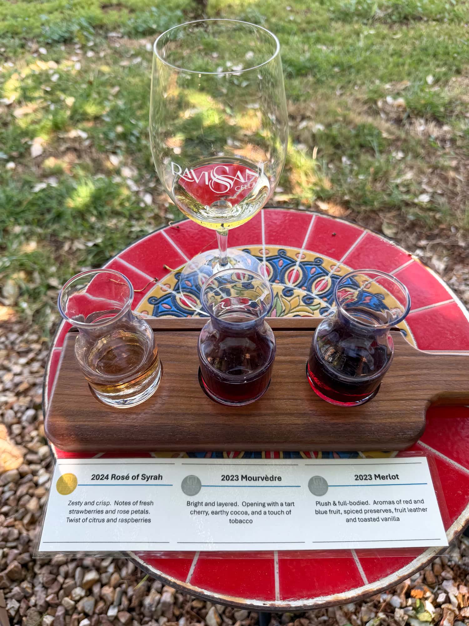 Wine flight at Ravissant Cellars with a rosé of Syrah, Mourvèdre, and Merlot.